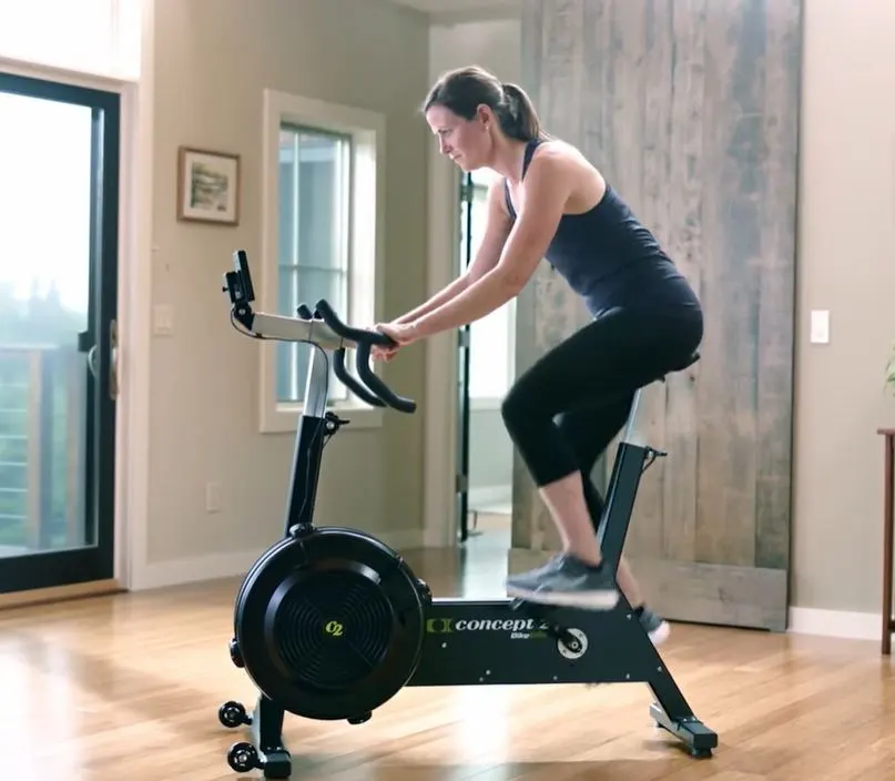 woman working out on concept 2 bikeerg