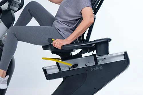 woman training on a recumbent exercise bike - image 02