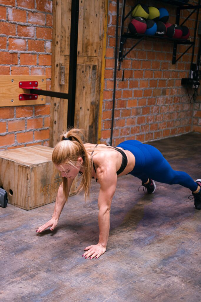 woman doing push-up plus serratus anterior exercises