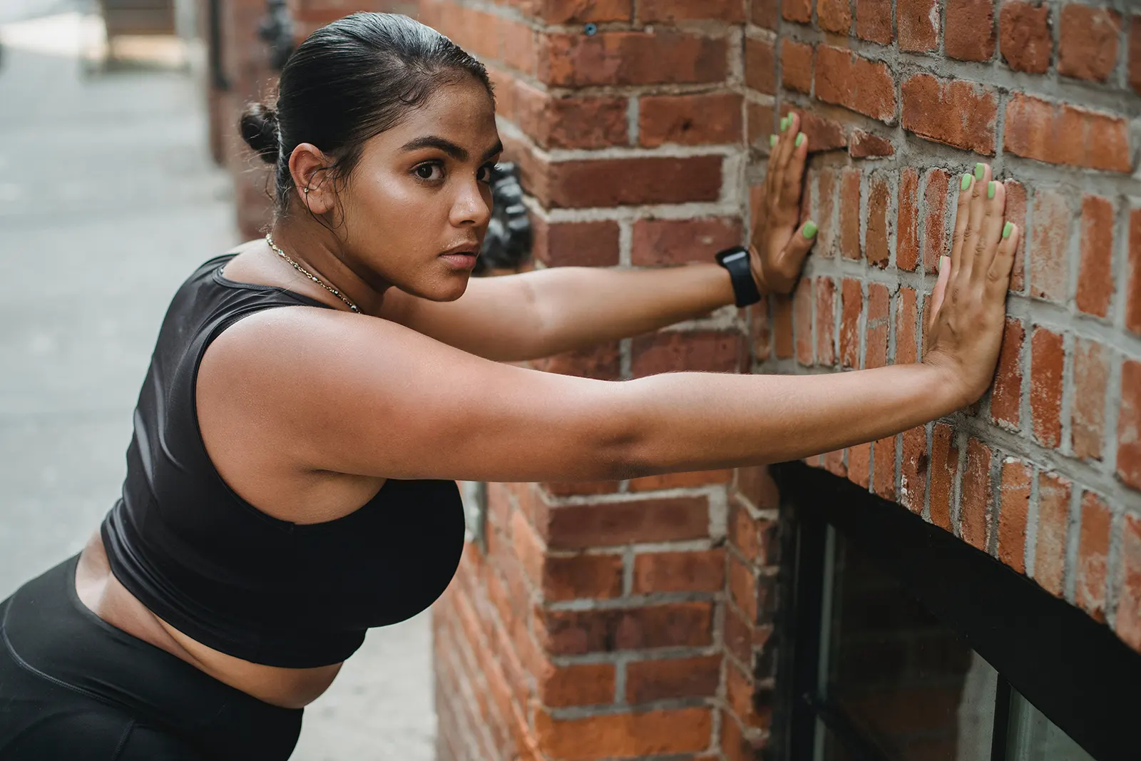 woman doing wall push exercises